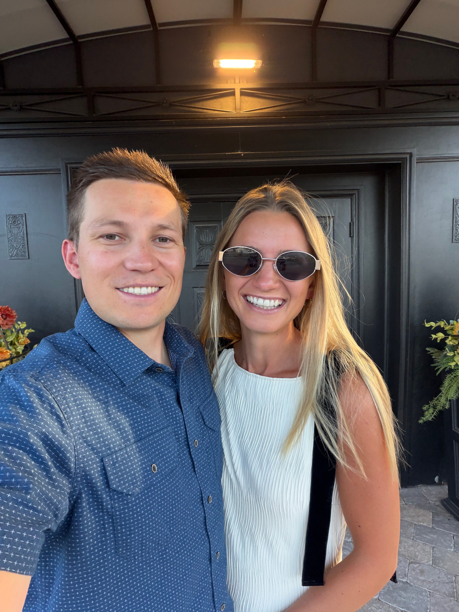 Justin Smith and his wife smiling together outdoors.